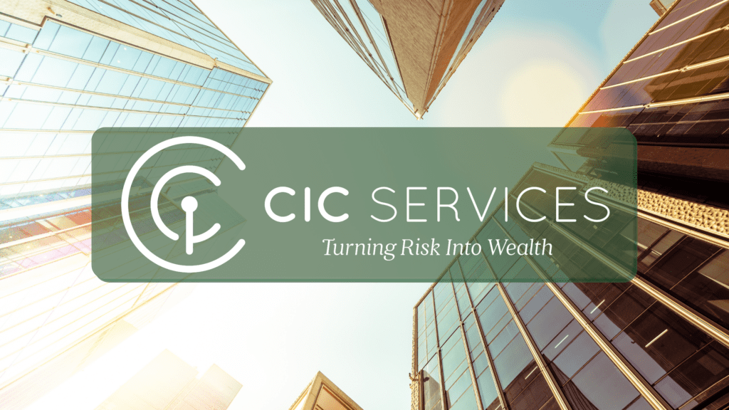 Vertical shot of skyscrapers with a sun glare with a logo saying CIC services