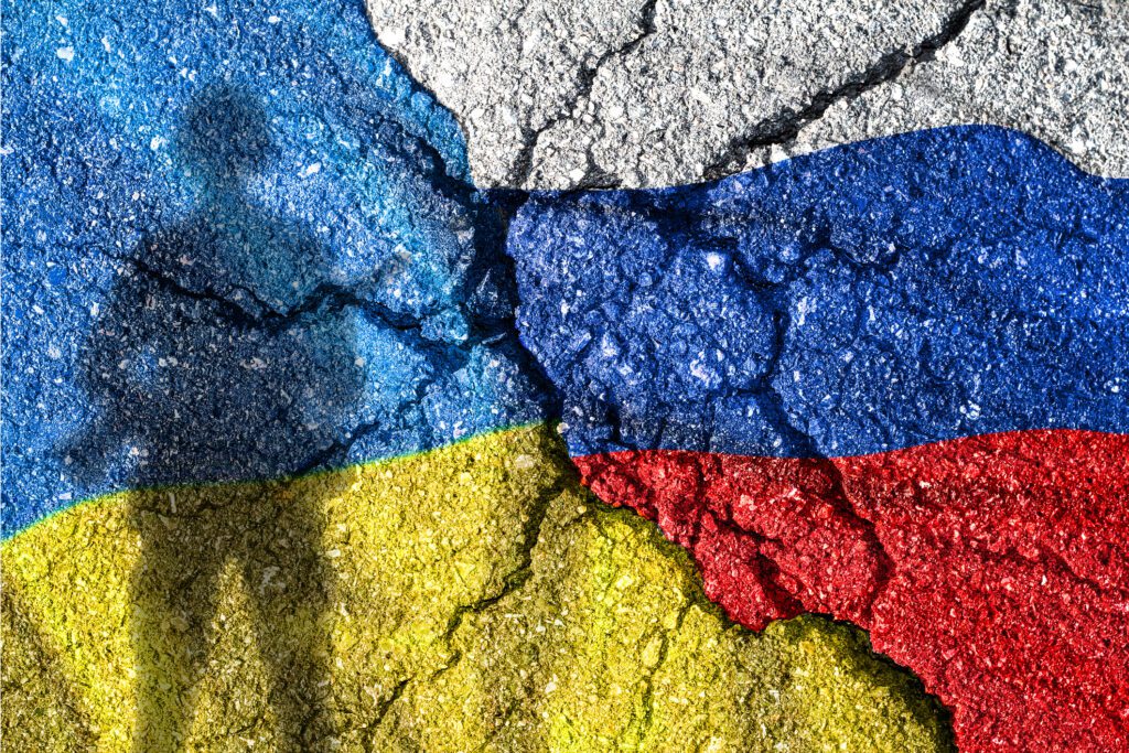 Ukraine and Russia flag with cracks, political conflict.